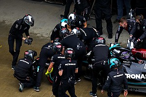 the-mercedes-pit-crew-work-on-